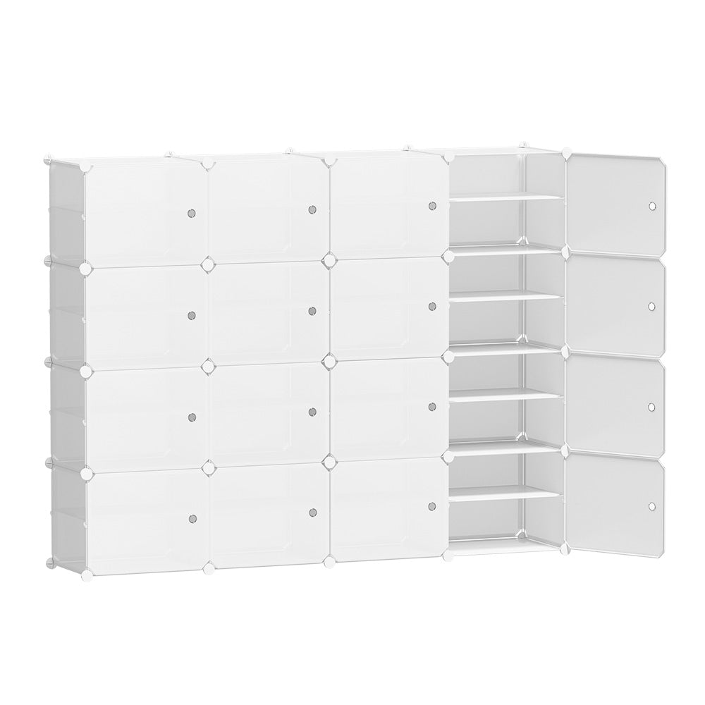 White modular 16-cube shoe cabinet in room with one column open showing shoe shelves, plants on top