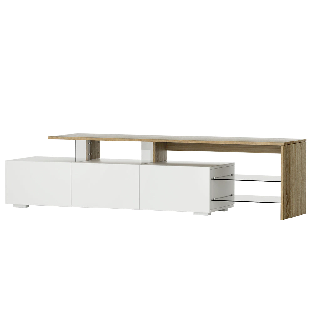 White and oak large stepped TV unit front view with three doors and open glass shelf on white background