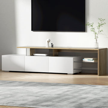 Close-up of white TV unit cabinet door open showing two silver metal hinges with oak top panel