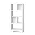 White asymmetric open bookcase with 7 compartments of varying sizes and a small drawer at base, white background