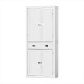 Tall white beadboard pantry cabinet angled view, upper and lower double doors with bronze knobs, middle drawer with cup pulls