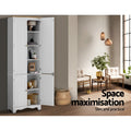White pantry cabinet with all doors open showing shelves in loft room; text: space maximisation, slim and practical