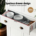 White pantry cabinet open drawer showing plates and cutlery, 58x30x11cm, 10kg capacity, text: Spacious drawer design