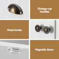 White pantry cabinet hardware: bronze cup handle, metal knobs and magnetic door catch