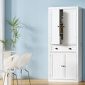 Tall white pantry cabinet in dining room, upper door open showing shelves, middle drawer with cup pulls, lower doors closed