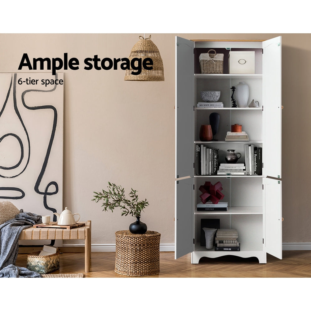 White tall pantry cabinet with all doors open showing 6-tier shelving with books and decor in room; text: ample storage