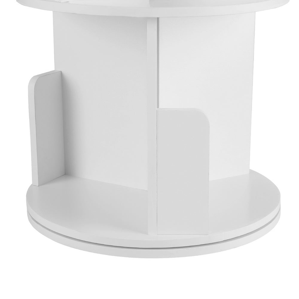 Close-up of white rotating tower shelf base showing round rotating base plate and lower shelf compartment dividers