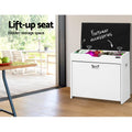 White shoe bench with black lid fully raised showing hidden storage compartment filled with footwear accessories