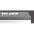 Close-up of grey fabric cushion on white shoe bench with plush comfort thick padded seat text overlay