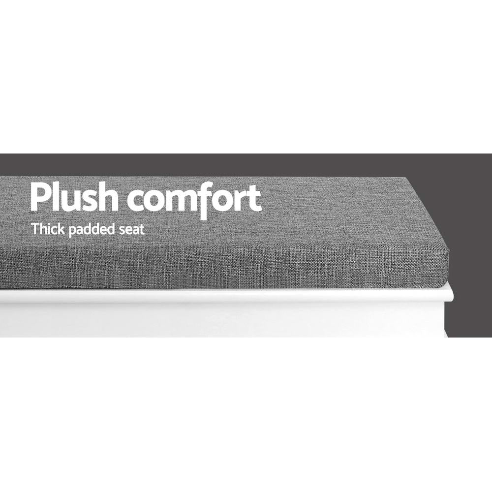 Close-up of grey fabric cushion on white shoe bench with plush comfort thick padded seat text overlay