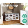 White shoe bench grey cushion loaded with shoes in warm hallway herringbone floor coat hooks functional design E1 MDF text