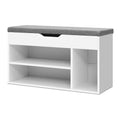 White shoe bench grey cushion top one drawer black handle open cubby shelves below three-quarter view on white background