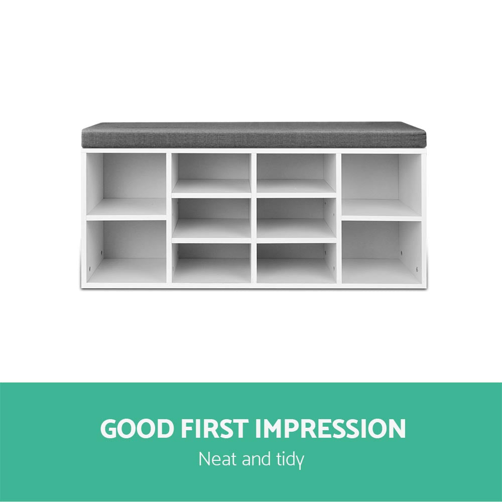 White shoe bench grey cushion front view all 10 open cubbies empty good first impression tidy text on teal banner