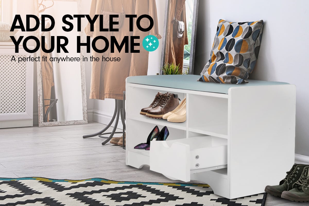 White shoe storage bench with blue PU cushion in styled entryway with mirror and coat rack behind