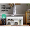 White shoe bench in hallway with shoes on lower shelves books in tall nook first impression counts up to 9 pairs badge