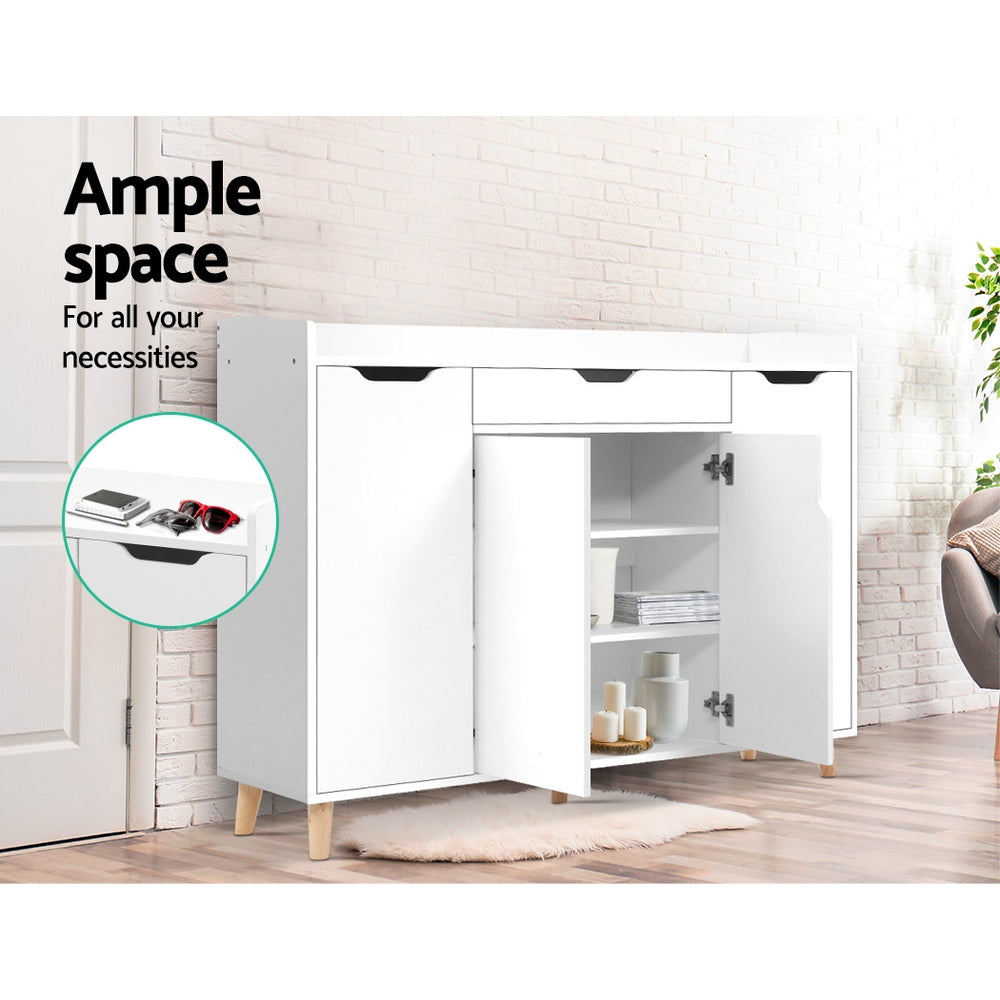 White shoe cabinet right door open showing shelves with candles and books ample space text inset of drawer with sunglasses