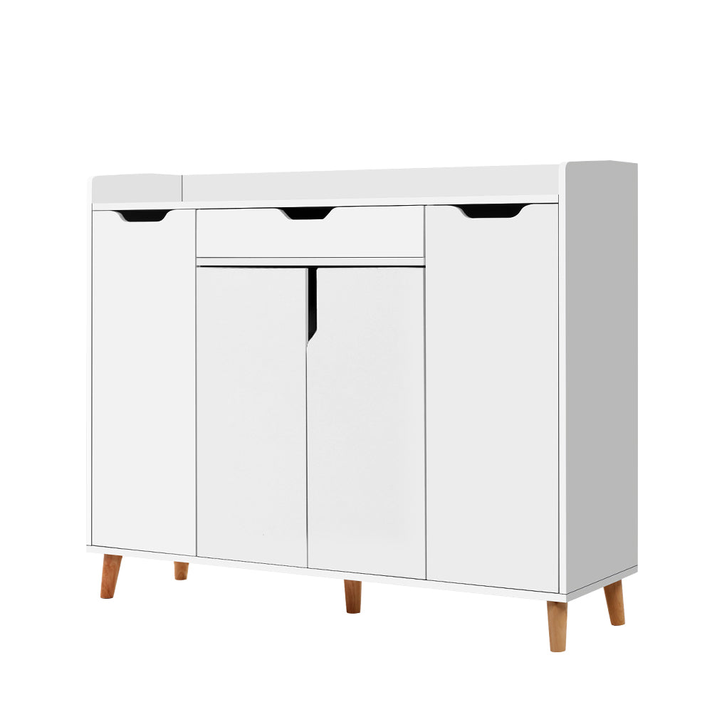 White shoe cabinet with top drawer three lower hinged doors and natural wood cone legs in hallway with herringbone floor