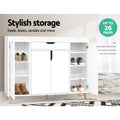 White shoe cabinet outer doors open with grey sneakers and ankle boots on shelves stylish storage up to 26 pairs badge