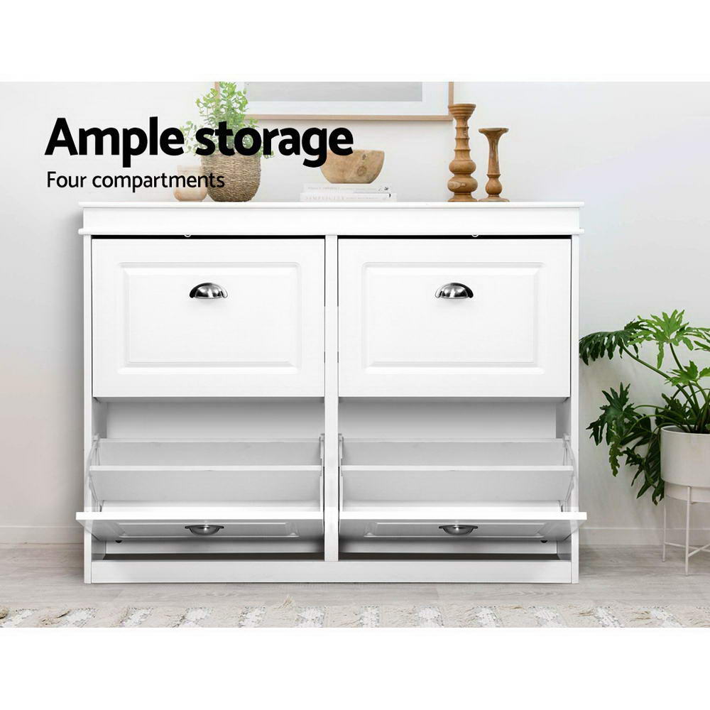 White shoe cabinet with two upper flip-out trays open and two lower doors closed in lifestyle setting with ample storage text