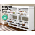 White shoe cabinet with all four compartments open showing flip-out shoe trays in hallway lifestyle with up to 16 pairs badge