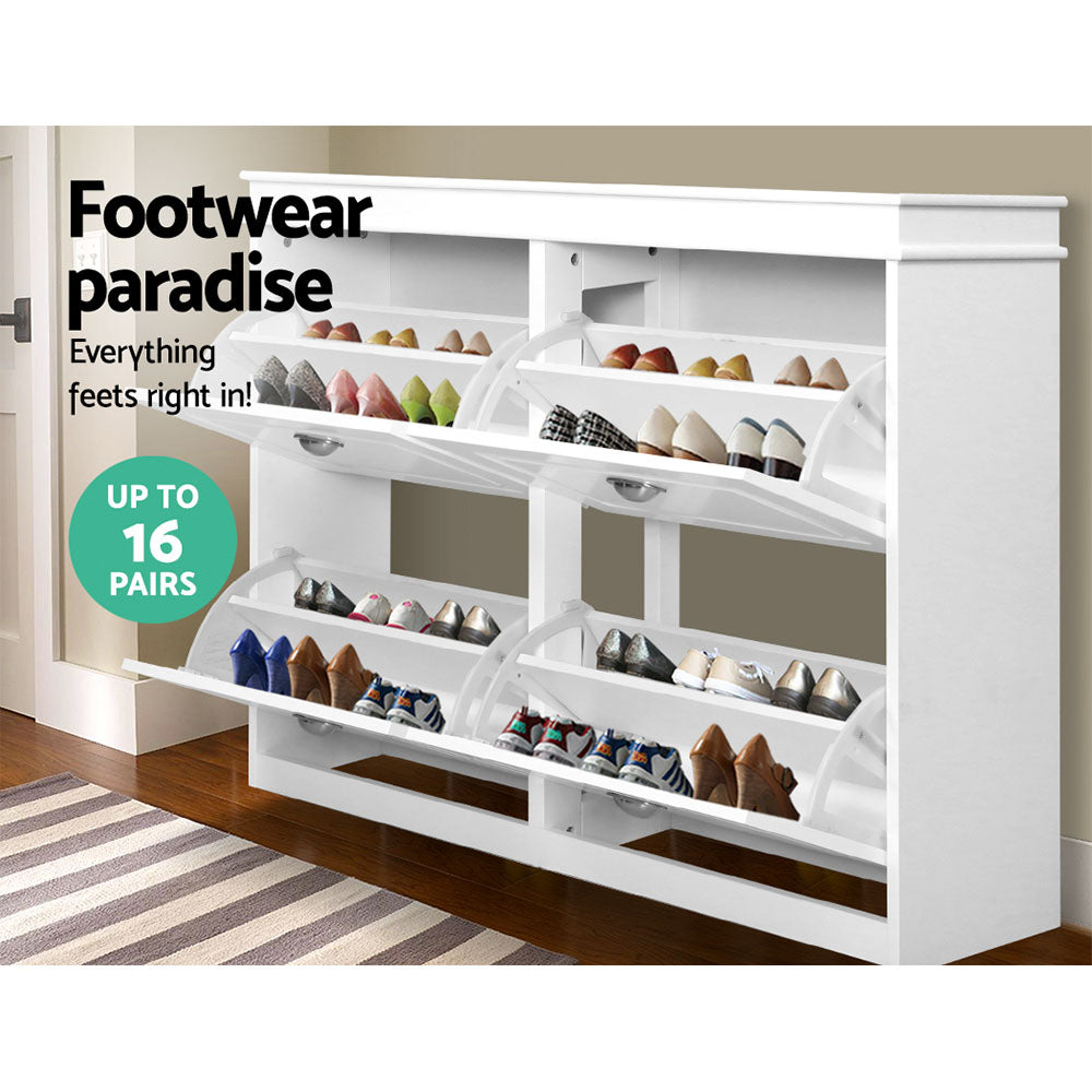 White shoe cabinet with all four compartments open showing flip-out shoe trays in hallway lifestyle with up to 16 pairs badge
