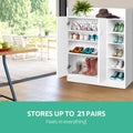 White shoe cabinet with doors and side shelves loaded with shoes showing stores up to 21 pairs capacity