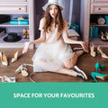 Woman in white dress sitting on floor surrounded by shoes with Space for your Favourites text in teal banner