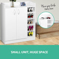 White shoe cabinet with heeled shoes on side shelves in lifestyle with small unit huge space text and shelf inset