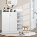 White 2-door shoe cabinet with 5-shelf side unit in hallway with round mirror and wooden stool