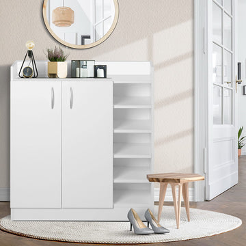 White 2-door shoe cabinet with 5-shelf side unit in hallway with round mirror and wooden stool