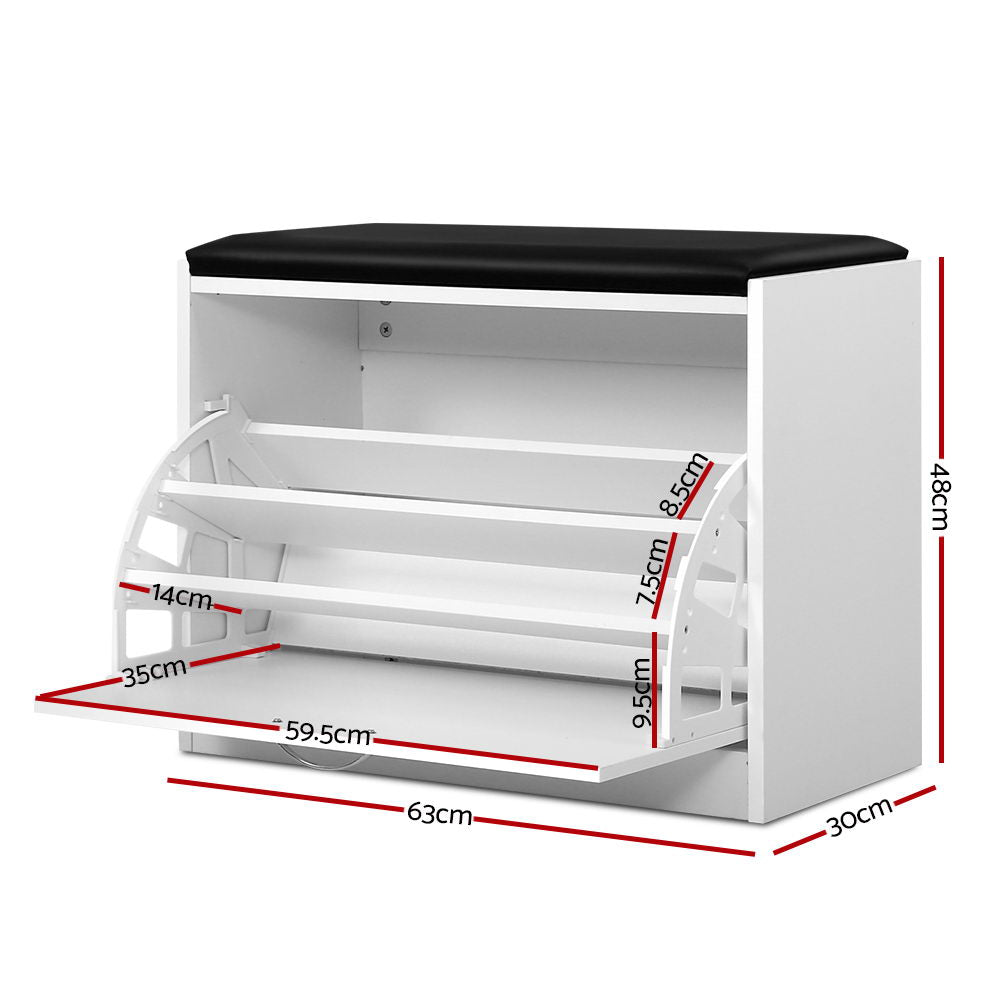 White shoe storage bench black PU seat cushion 3 tilting shelves deployed loaded with heels and flats in room