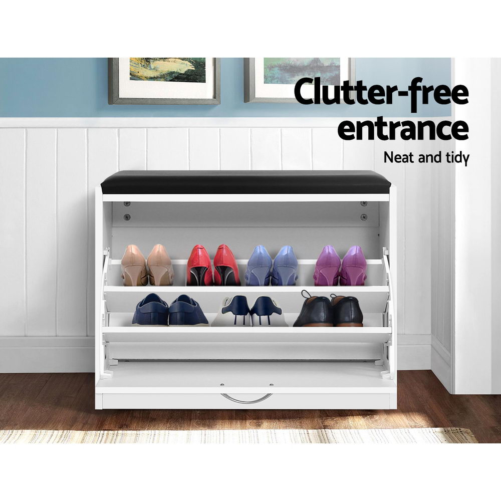 White shoe storage bench shelves loaded with heels pumps and dress shoes in blue entry room