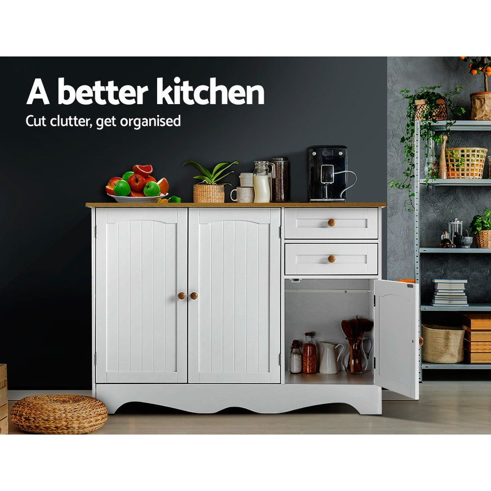 White sideboard with right cabinet open in kitchen, fruit bowl and coffee machine on top; text: a better kitchen