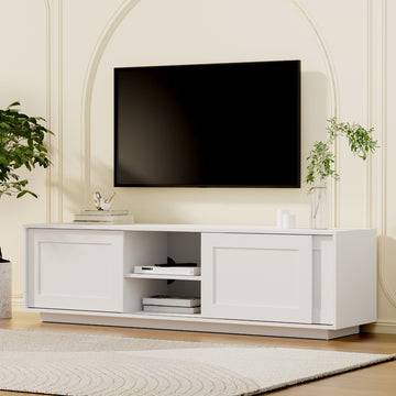 White TV unit 160cm sliding Shaker-panel doors in cream arched room with wall-mounted TV plant vase and bird ornament