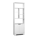 White tall bookcase with staggered open shelves and two-door cabinet base, angle view on white background