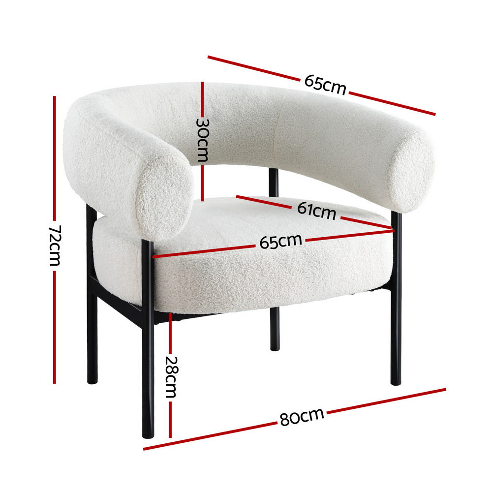White teddy fabric barrel armchair with curved wraparound backrest on black metal frame in lifestyle room