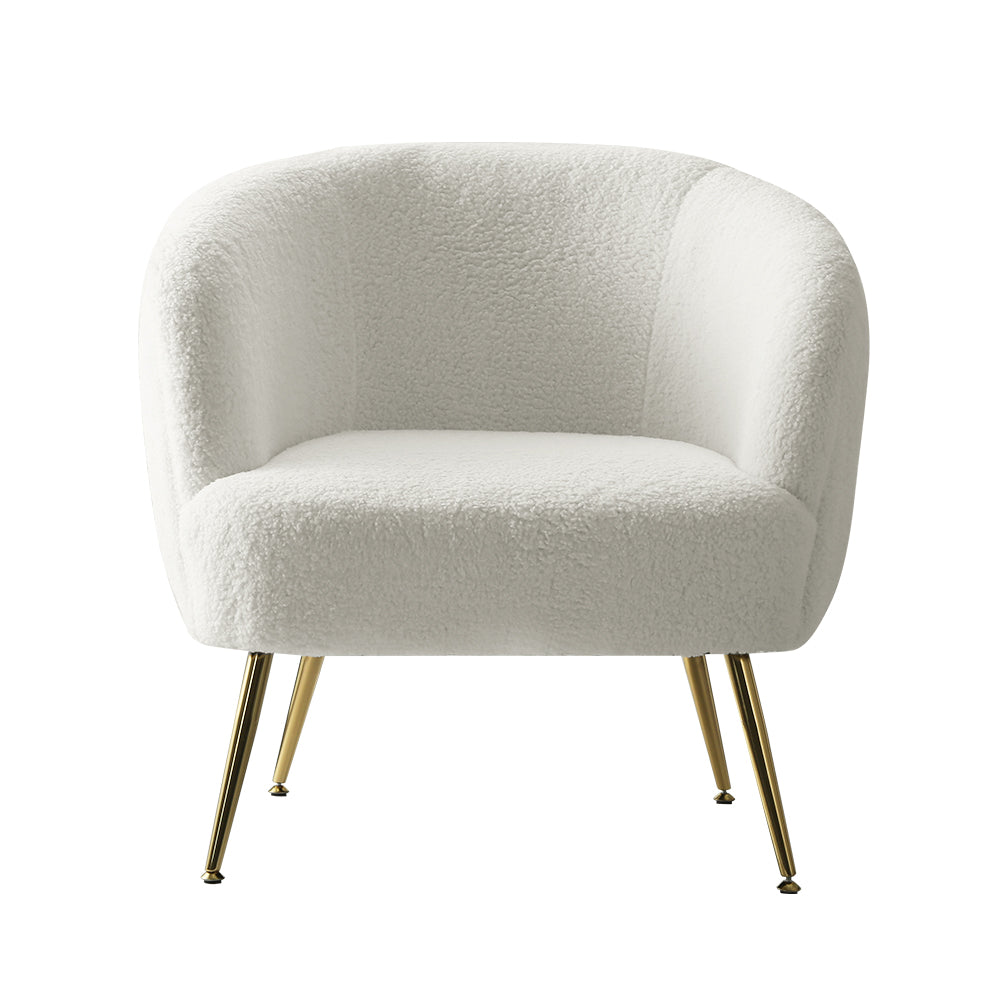 White teddy fabric barrel armchair with curved backrest and splayed gold metal legs front view on white background