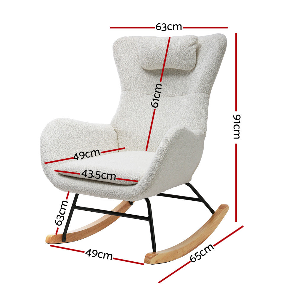 White teddy wingback rocking chair with headrest pillow and wood rocker runners in lifestyle room with side table and plants