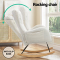 White teddy rocking chair with rocking motion arrows and anti-slip base badge in lifestyle room beside rattan sideboard