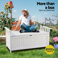 Man in straw hat seated on white timber storage bench in garden; text: more than a box, built-in handles, 300kg capacity