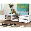 White TV unit 120cm creative display lifestyle with door open wicker basket drawers and colourful items
