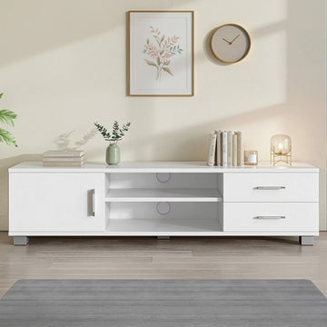 White TV unit in cream room with left cabinet door two center open shelves two right drawers bar handles vase and lamp
