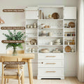 Open white pantry cabinet in dining room showing capacity labels: top 20kg, shelves 20kg each, door shelves 5kg, drawers 10kg
