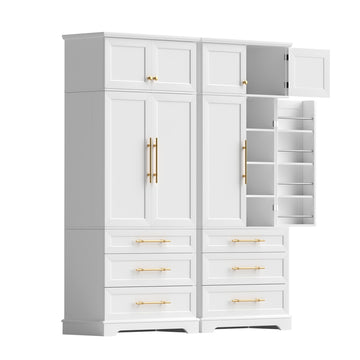 Pair of white tall storage cabinets with gold handles, right unit open showing door shelves and interior, white background