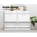 Two white wide shoe cabinets side by side lower trays open ample storage 4 compartments and 2 drawers text with plant decor
