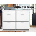 White wide shoe cabinet all six doors closed in hallway with teal wall plants umbrella clutter-free design text