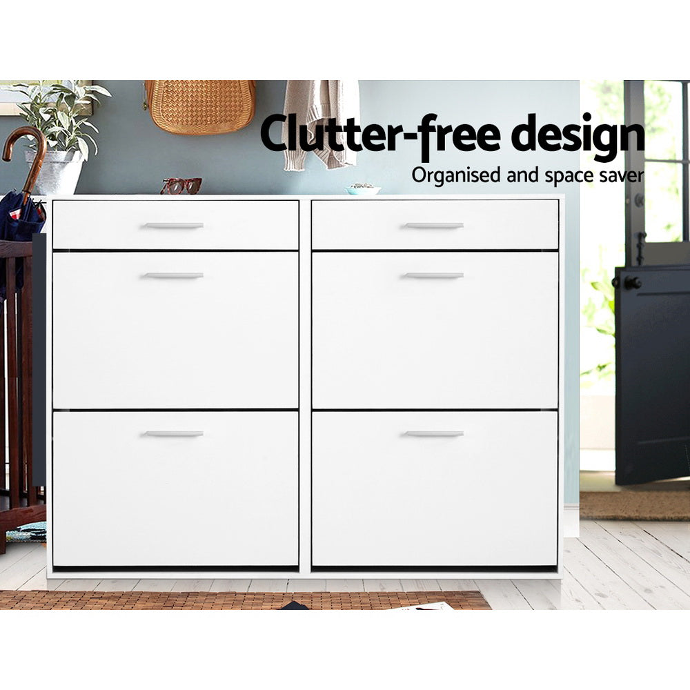 White wide shoe cabinet all six doors closed in hallway with teal wall plants umbrella clutter-free design text