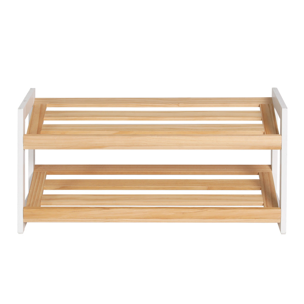 Two-tier shoe rack with white MDF side panels and natural wood slatted shelves, empty, front view