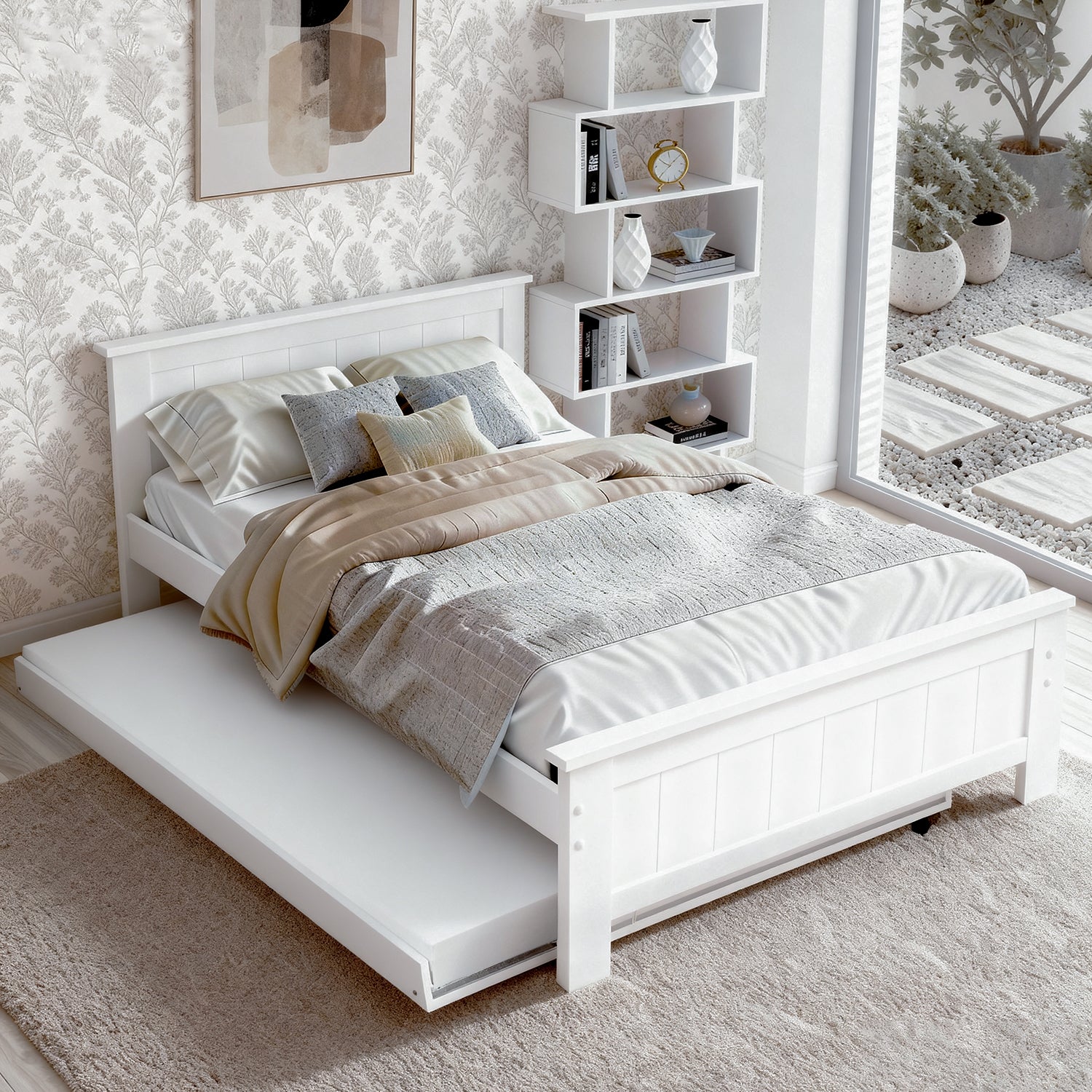 White wooden bed frame with trundle extended in bedroom with floral wallpaper and white zigzag bookshelf in background