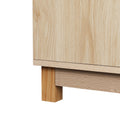 Close-up detail of natural wood lower corner showing rubberwood leg and base rail on white background